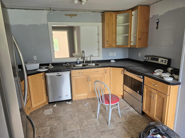 14901 County Highway 29, Burlington Twp, MN 56544 - kitchen featuring stainless steel appliances, dark countertops, glass insert cabinets, and light brown cabinets