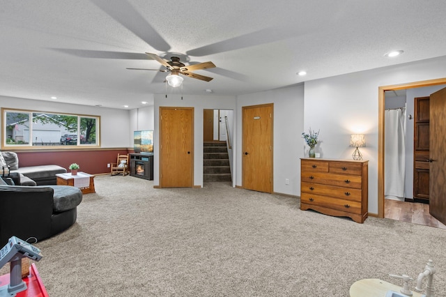 13610 Prairie Ct, Becker, MN 55308 - carpeted living area featuring stairway, a ceiling fan, recessed lighting, and a textured ceiling