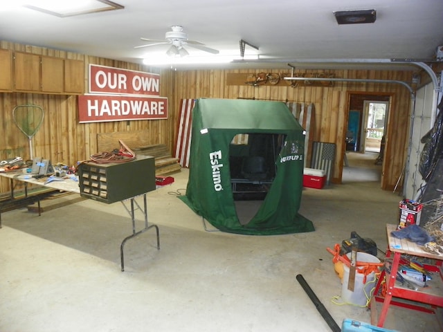 4527 Cushing Ave NW, Buffalo, MN 55313 - garage with wood walls and a ceiling fan