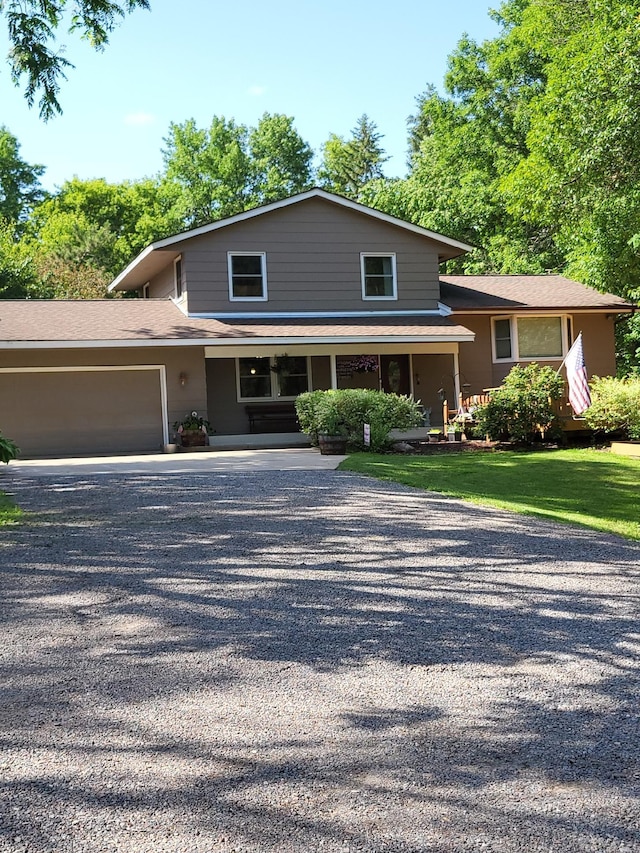 4527 Cushing Ave NW, Buffalo, MN 55313 - view of front of property with driveway, a garage, and covered porch
