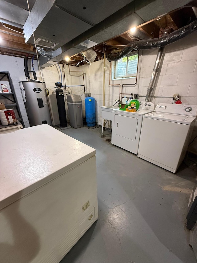 4527 Cushing Ave NW, Buffalo, MN 55313 - basement featuring washer and clothes dryer, a water pressure tank, a water softener system, and fridge