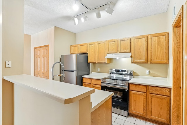 3730 Vermilion Ct S Unit 509, Eagan, MN 55122 - kitchen featuring stainless steel appliances, under cabinet range hood, a textured ceiling, light tile patterned flooring, and light countertops