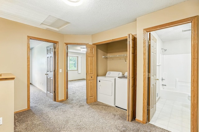 3730 Vermilion Ct S Unit 509, Eagan, MN 55122 - laundry room with washing machine and clothes dryer, light colored carpet, and a textured ceiling