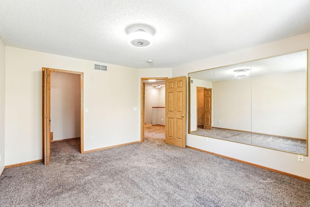 3730 Vermilion Ct S Unit 509, Eagan, MN 55122 - unfurnished bedroom featuring carpet flooring, a closet, and a textured ceiling