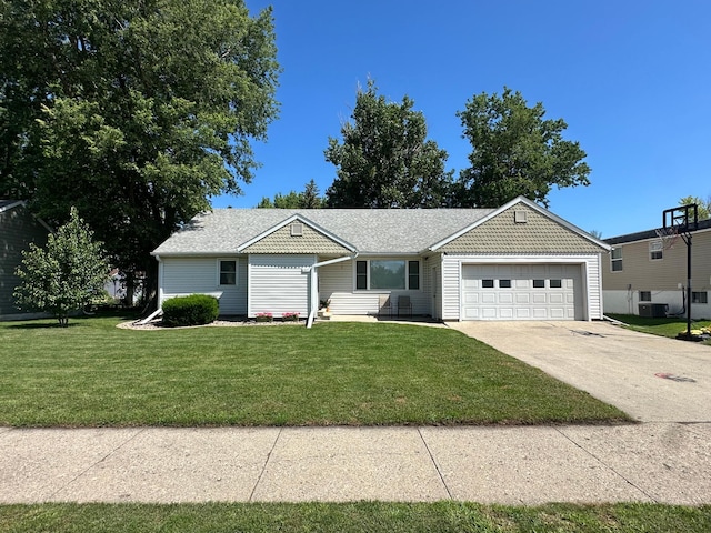 317 Clary St, Worthington, MN 56187 - ranch-style house featuring an attached garage, a front lawn, and concrete driveway