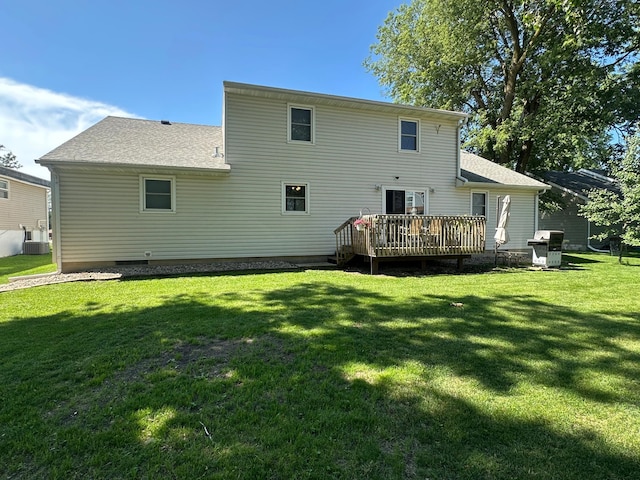 317 Clary St, Worthington, MN 56187 - rear view of property with a wooden deck, a lawn, and roof with shingles