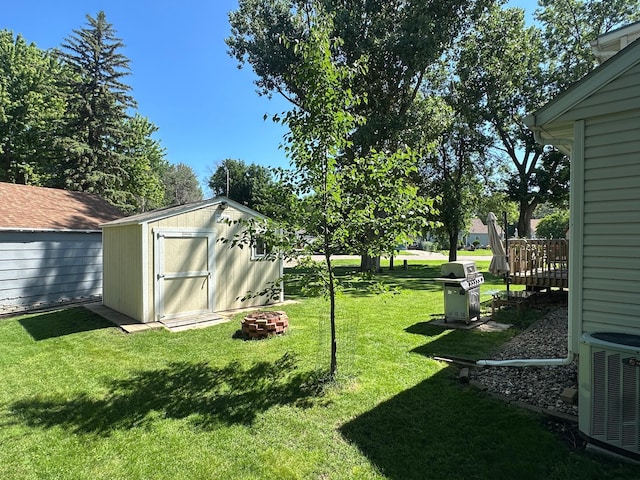 317 Clary St, Worthington, MN 56187 - view of grassy yard featuring a storage shed
