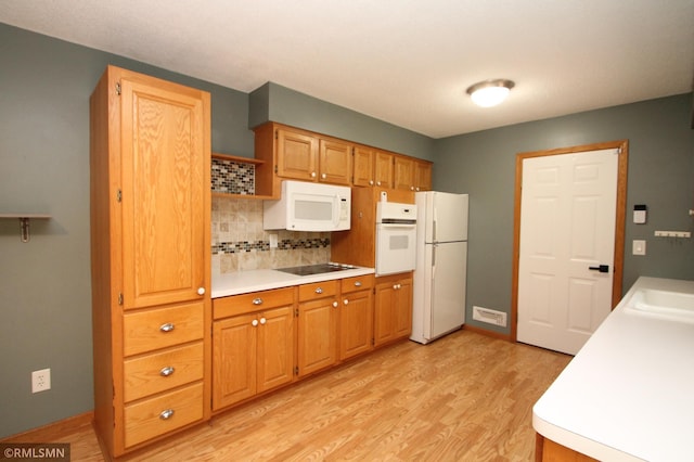 10628 Direct River Dr NW, Coon Rapids, MN 55433 - kitchen featuring white appliances, open shelves, light countertops, light wood-type flooring, and backsplash