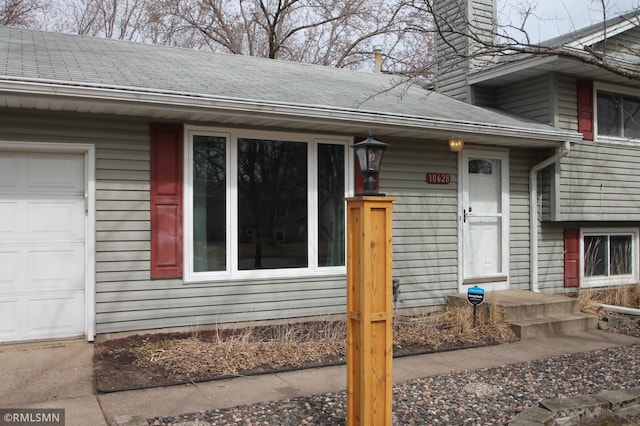 10628 Direct River Dr NW, Coon Rapids, MN 55433 - property entrance featuring a chimney