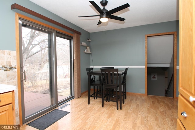 10628 Direct River Dr NW, Coon Rapids, MN 55433 - dining area featuring light wood-style flooring and a ceiling fan