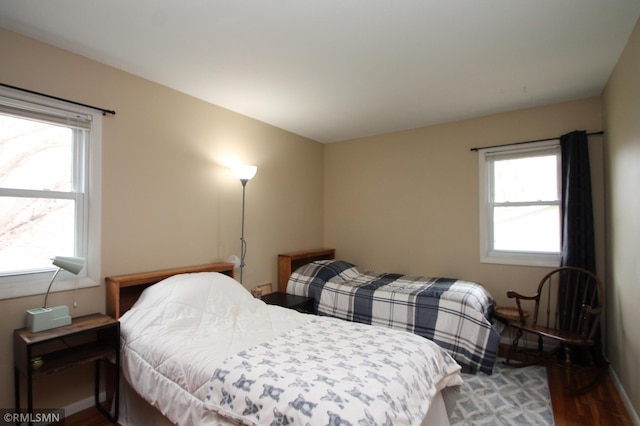 10628 Direct River Dr NW, Coon Rapids, MN 55433 - bedroom featuring wood finished floors and baseboards