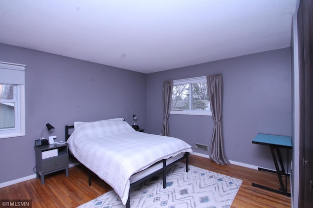10628 Direct River Dr NW, Coon Rapids, MN 55433 - bedroom featuring wood finished floors and baseboards
