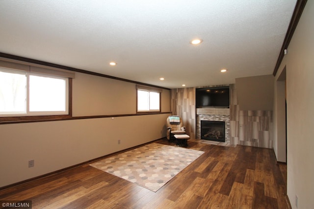 10628 Direct River Dr NW, Coon Rapids, MN 55433 - living area featuring wood finished floors, a fireplace, recessed lighting, and ornamental molding