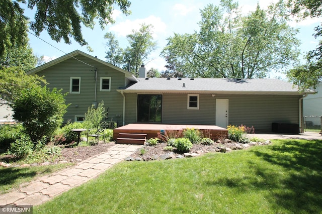 10628 Direct River Dr NW, Coon Rapids, MN 55433 - back of property with a wooden deck, a lawn, and a chimney