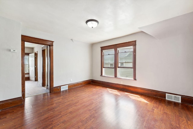 906 5th St E, Saint Paul, MN 55106 - empty room with wood finished floors and baseboards