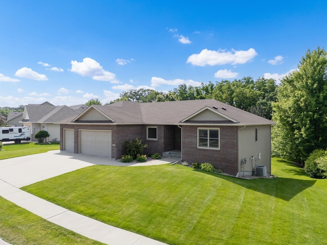 2309 Teakwood Ln SW, Rochester, MN 55902 - ranch-style house with an attached garage, a front lawn, driveway, and brick siding