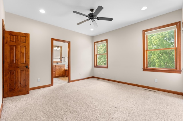 2309 Teakwood Ln SW, Rochester, MN 55902 - unfurnished bedroom with light colored carpet, recessed lighting, ensuite bathroom, and a ceiling fan