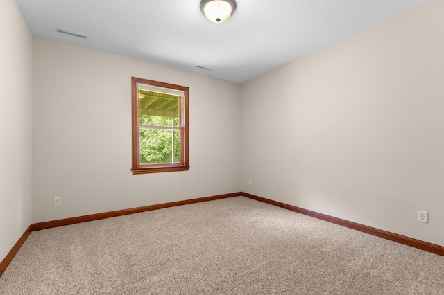 2309 Teakwood Ln SW, Rochester, MN 55902 - carpeted spare room with baseboards