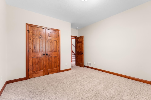 2309 Teakwood Ln SW, Rochester, MN 55902 - unfurnished bedroom with carpet and a closet