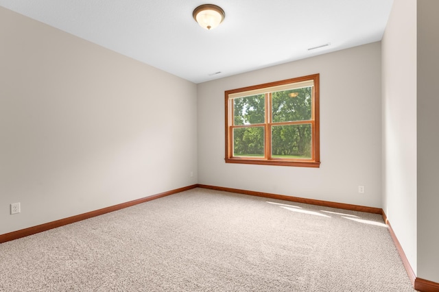 2309 Teakwood Ln SW, Rochester, MN 55902 - carpeted spare room with baseboards