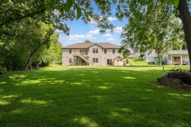 2309 Teakwood Ln SW, Rochester, MN 55902 - view of grassy yard featuring stairs and a deck