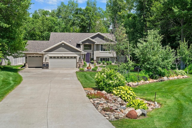 15784 103rd St SE, Becker Twp, MN 55308 - view of front of house with concrete driveway, a front lawn, an attached garage, a shingled roof, and stone siding