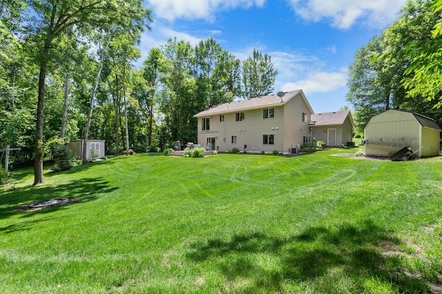 15784 103rd St SE, Becker Twp, MN 55308 - rear view of property with a storage shed and a yard
