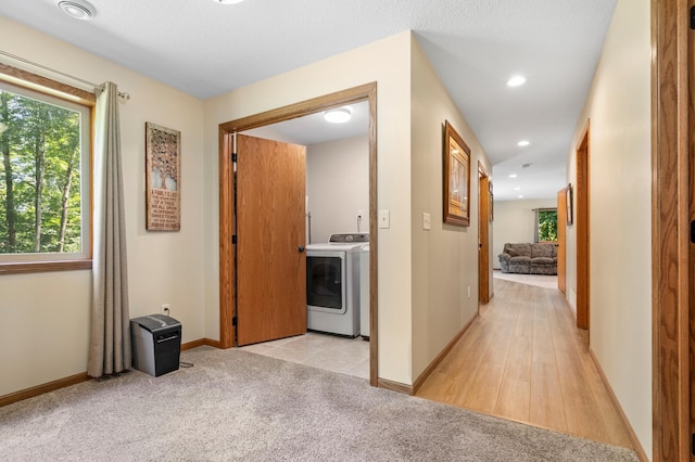 15784 103rd St SE, Becker Twp, MN 55308 - corridor featuring washing machine and clothes dryer, light carpet, and recessed lighting