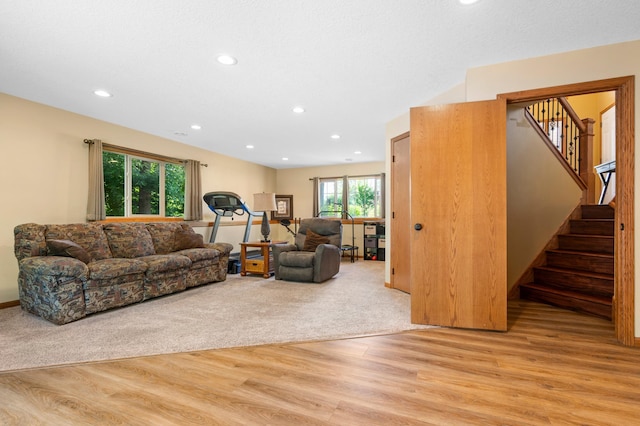 15784 103rd St SE, Becker Twp, MN 55308 - living room featuring light wood-type flooring, stairs, and recessed lighting
