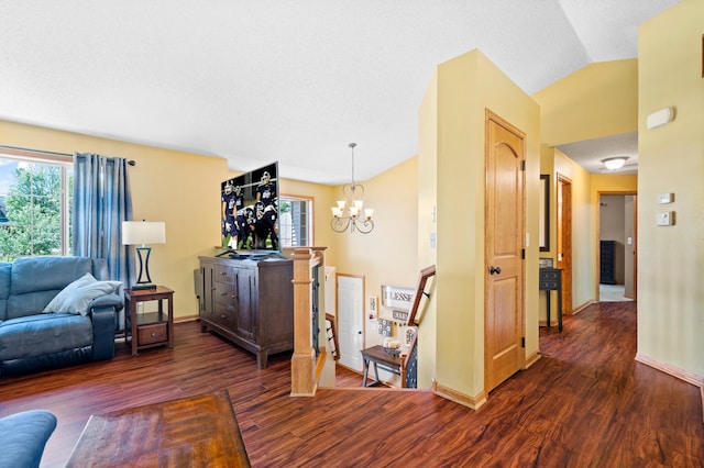 15784 103rd St SE, Becker Twp, MN 55308 - living area featuring wood finished floors, a chandelier, and vaulted ceiling