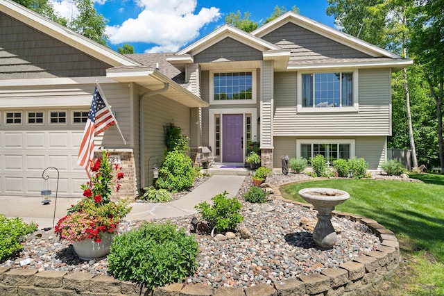 15784 103rd St SE, Becker Twp, MN 55308 - view of front of property with an attached garage and a front lawn