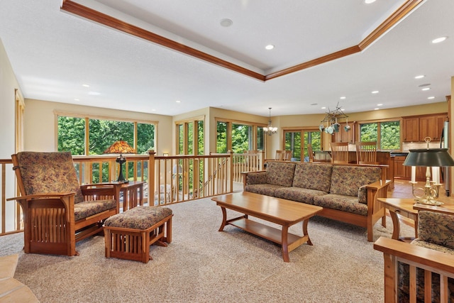 9449 Ehler Ave SE, Delano, MN 55328 - living area featuring ornamental molding, a chandelier, recessed lighting, light colored carpet, and a raised ceiling