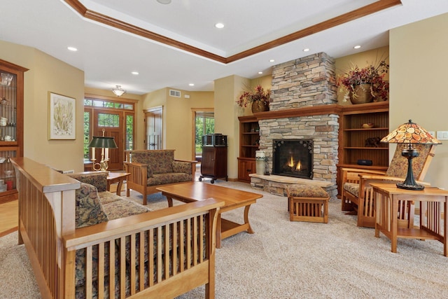 9449 Ehler Ave SE, Delano, MN 55328 - living area with carpet floors, recessed lighting, a fireplace, a tray ceiling, and crown molding
