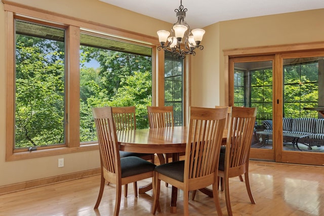 9449 Ehler Ave SE, Delano, MN 55328 - dining room featuring healthy amount of natural light, light wood-style floors, and a chandelier
