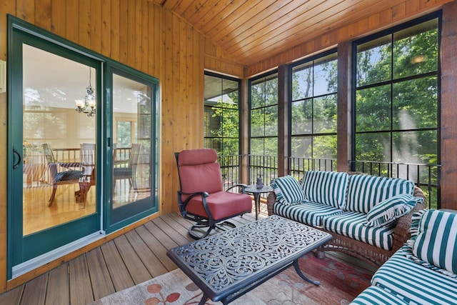9449 Ehler Ave SE, Delano, MN 55328 - sunroom / solarium featuring lofted ceiling, an outdoor living space, plenty of natural light, and a chandelier