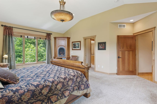 9449 Ehler Ave SE, Delano, MN 55328 - carpeted bedroom with lofted ceiling and a lit fireplace