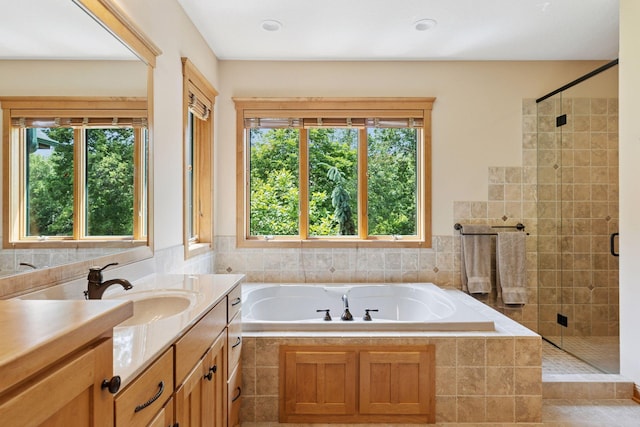 9449 Ehler Ave SE, Delano, MN 55328 - full bath featuring a bath, a stall shower, and vanity