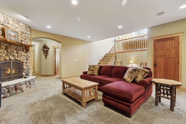 9449 Ehler Ave SE, Delano, MN 55328 - living room with carpet, arched walkways, stairs, recessed lighting, and a fireplace