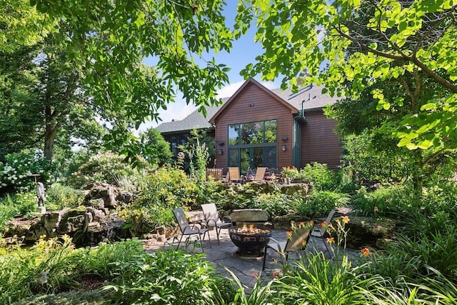 9449 Ehler Ave SE, Delano, MN 55328 - view of patio / terrace with a fire pit