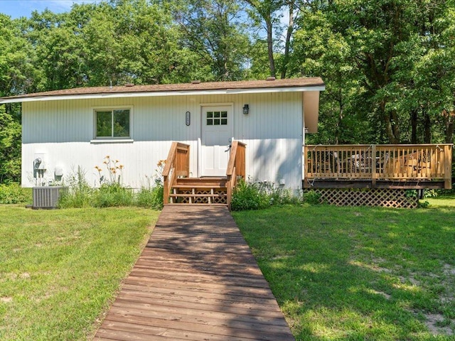 12698 Omega Ln, Center Twp, MN 56465 - view of front of house featuring a front lawn and a deck