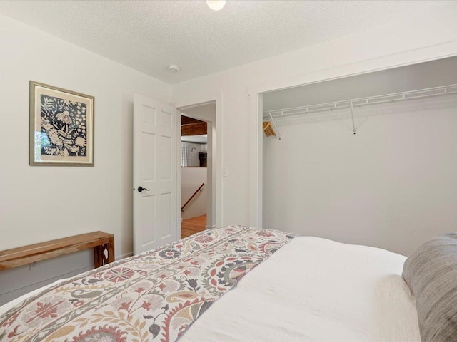 12698 Omega Ln, Center Twp, MN 56465 - bedroom featuring a closet and a textured ceiling