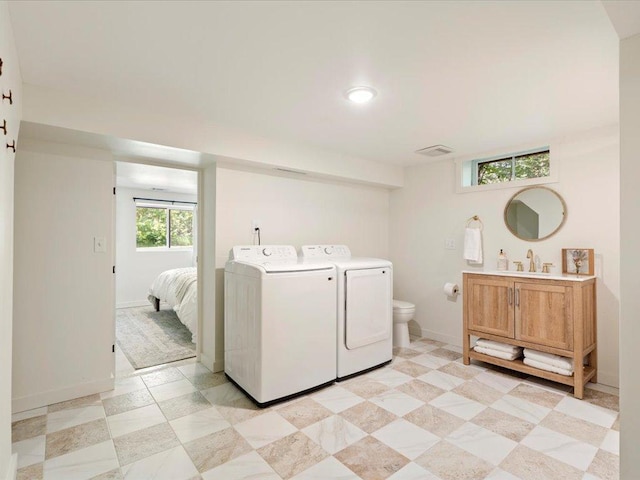 12698 Omega Ln, Center Twp, MN 56465 - laundry room with washing machine and dryer and baseboards