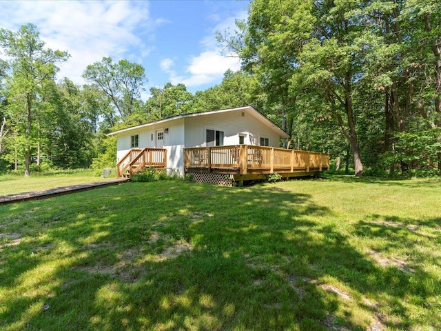 12698 Omega Ln, Center Twp, MN 56465 - rear view of property with a deck and a lawn