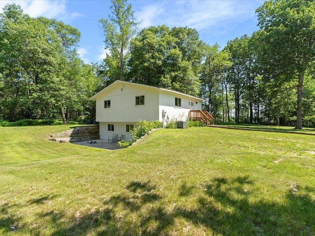 12698 Omega Ln, Center Twp, MN 56465 - view of property exterior featuring a patio area, a lawn, and view of scattered trees