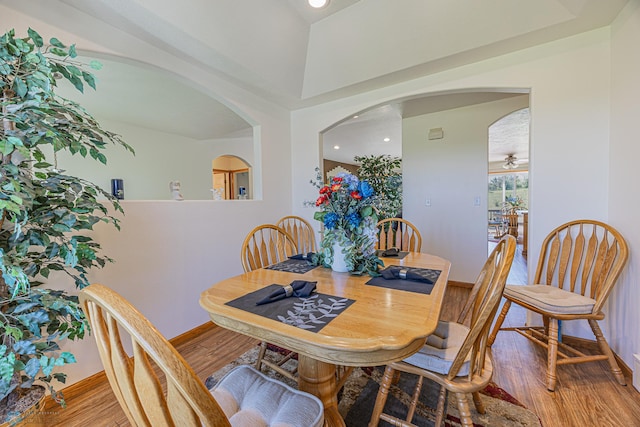 17123 Lakeview Ln, Audubon, MN 56511 - dining area with arched walkways, wood finished floors, and recessed lighting