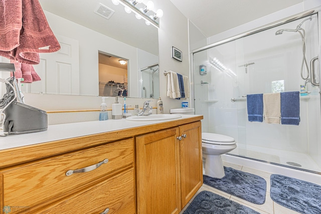 17123 Lakeview Ln, Audubon, MN 56511 - bathroom featuring tile patterned flooring, a shower stall, vanity, and a spacious closet