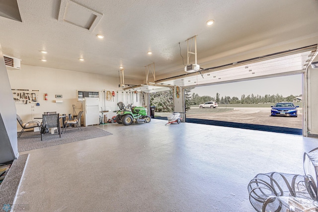 17123 Lakeview Ln, Audubon, MN 56511 - garage featuring recessed lighting and freestanding refrigerator