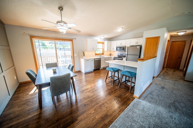 724 50th Ave NW, Rochester, MN 55901 - dining room featuring a ceiling fan, dark wood finished floors, and vaulted ceiling