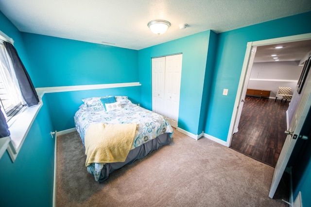 724 50th Ave NW, Rochester, MN 55901 - carpeted bedroom featuring baseboards and a closet
