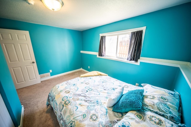 724 50th Ave NW, Rochester, MN 55901 - carpeted bedroom featuring a textured ceiling